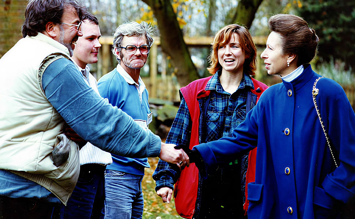 A photograph of Princess Anne, the Princess Royal, meeting and shaking hands with members of the wider NCRC team